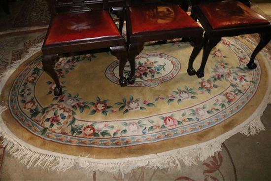 Chinese gold ground flower embossed oval rug